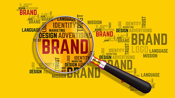 Brand identity concept with the word brand under a magnifying glass
